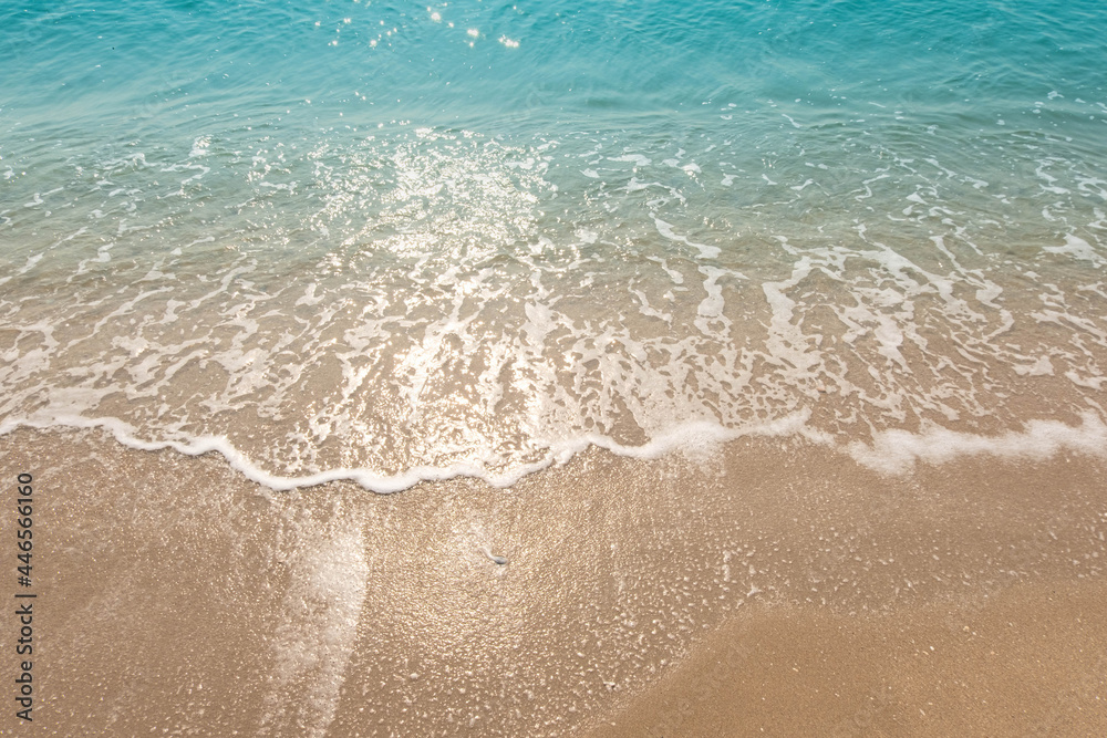 Blue ocean waves Sunlight Reflection Sand Beach background