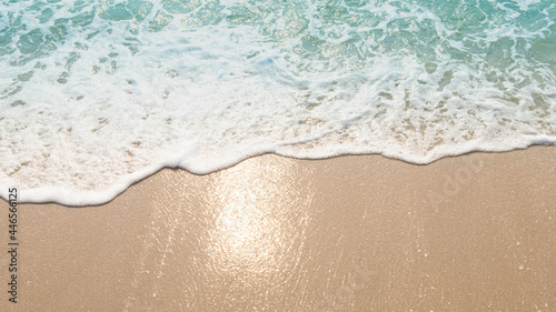 Fototapeta Naklejka Na Ścianę i Meble -  Blue ocean waves Sunlight Reflection Sand Beach background