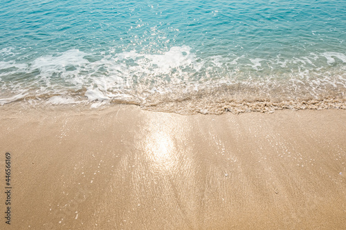 Blue ocean waves Sunlight Reflection Sand Beach background