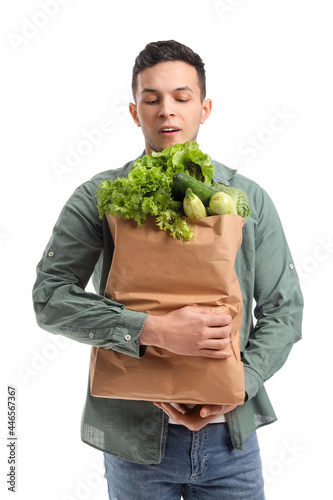 Young man and paper bag wit...