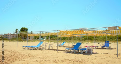 Wallpaper Mural Blue Lounge And Deck Chairs At Empty Beach During COVID-19 Pandemic On A Sunny Summer Day. - wide shot Torontodigital.ca