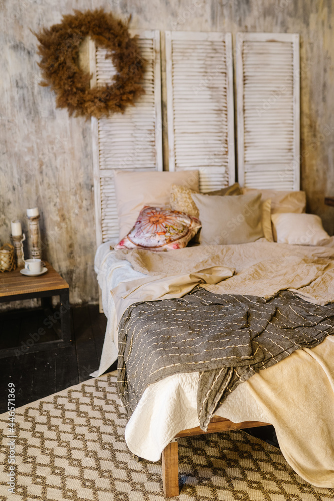 Bedroom interior design with large bed in loft and boho style