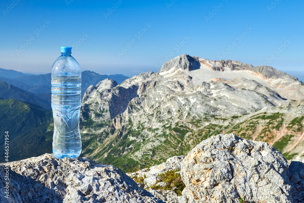 Fototapeta premium A bottle of clean water in the mountains