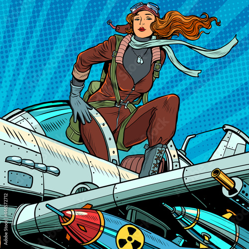 Pin-up military pilot. Beautiful woman in uniform on a plane with bombs and heavy weapons