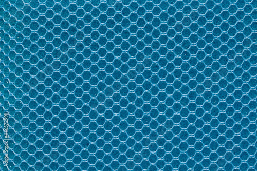 Full frame blue hexagon mesh pattern background.