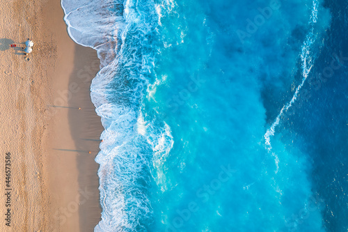 Aerial top down view to the fluorescent sea of the island Lefkada, Ionian Sea, Greece, with copy space