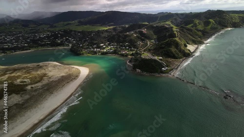 Mangawhai township and Mangawhai Heads walking area on New Zealand shore. Aerial landscape photo