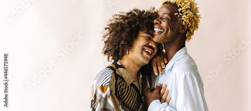 Картината върху платно Happy young gay couple standing in a studio