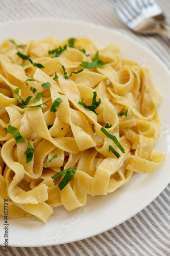 Homemade One Pot Garlic Parmesan Pasta with Parsley, side view.