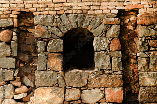 View from the ancient stone window, Medieval stone arch, Arch in stone wall
