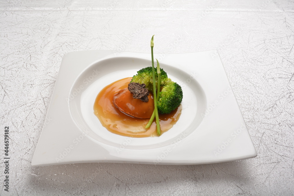 braised single whole big abalone seafood with vegetable and black truffle , ginseng in chef oyster sauce asian premium halal menu braised single whole big abalone seafood with vegetable and black truffle , ginseng in chef oyster sauce asian premium halal menu