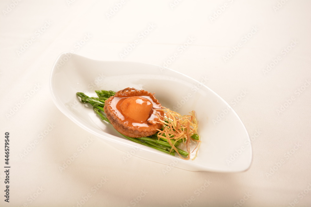 braised single whole big abalone seafood with vegetable and black truffle , ginseng in chef oyster sauce asian premium halal menu braised single whole big abalone seafood with vegetable and black truffle , ginseng in chef oyster sauce asian premium halal menu