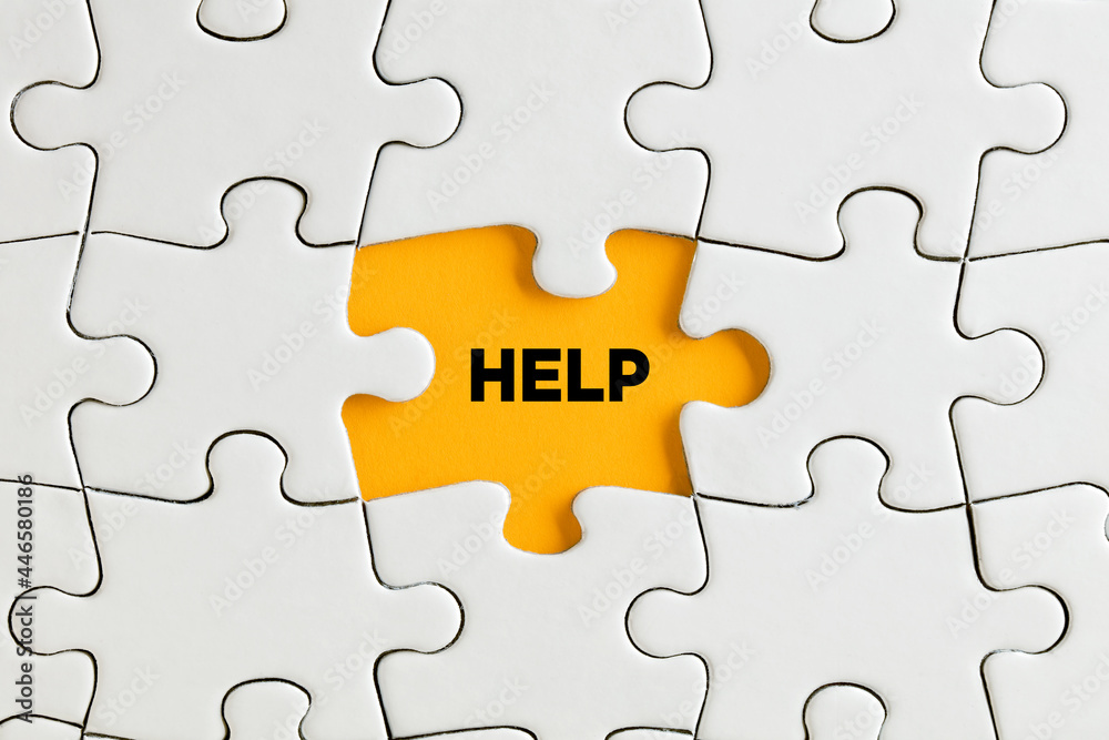 The word help on yellow missing puzzle piece. Support, assistance or guidance The word help on yellow missing puzzle piece. Support, assistance or guidance