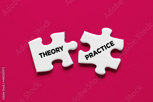 Theory and practice relationship or connection concept. Two puzzle pieces with the words theory and practice are connecting. photo