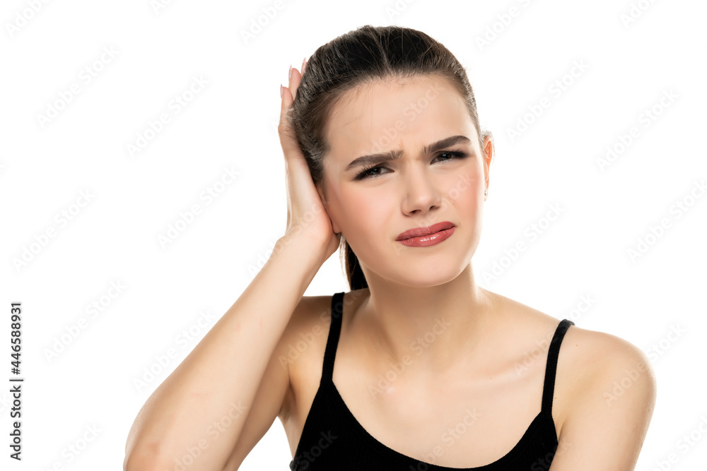 portrait of a frowning teen girl with ear pain portrait of a frowning teen girl with ear pain