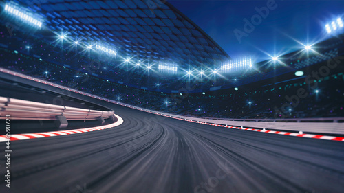 Fotografija Curved asphalt racing track and illuminated race sport stadium at night