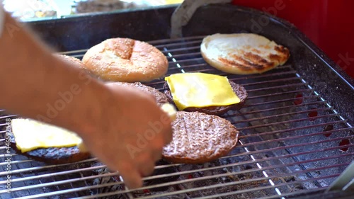 Fllipping bread on grill with hands. Close up of bread in grill photo
