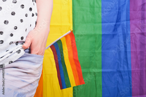 Rainbow LGBT flag in the back pocket of jeans, concept of gender equality.