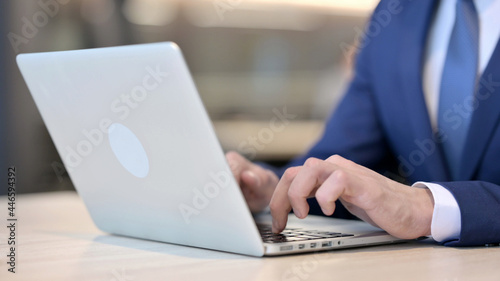 Close up of Businessman Working on Laptop
