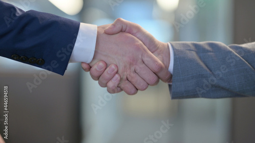 Hand Shake by Two Businessmen at Work