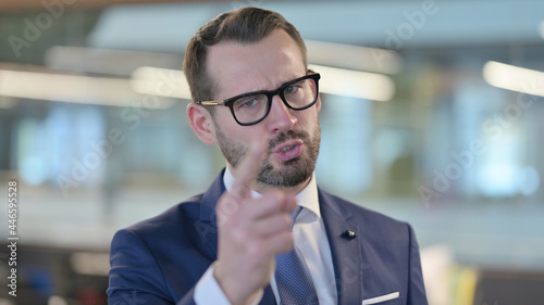 Portrait of Angry Middle Aged Businessman Arguing, Shouting