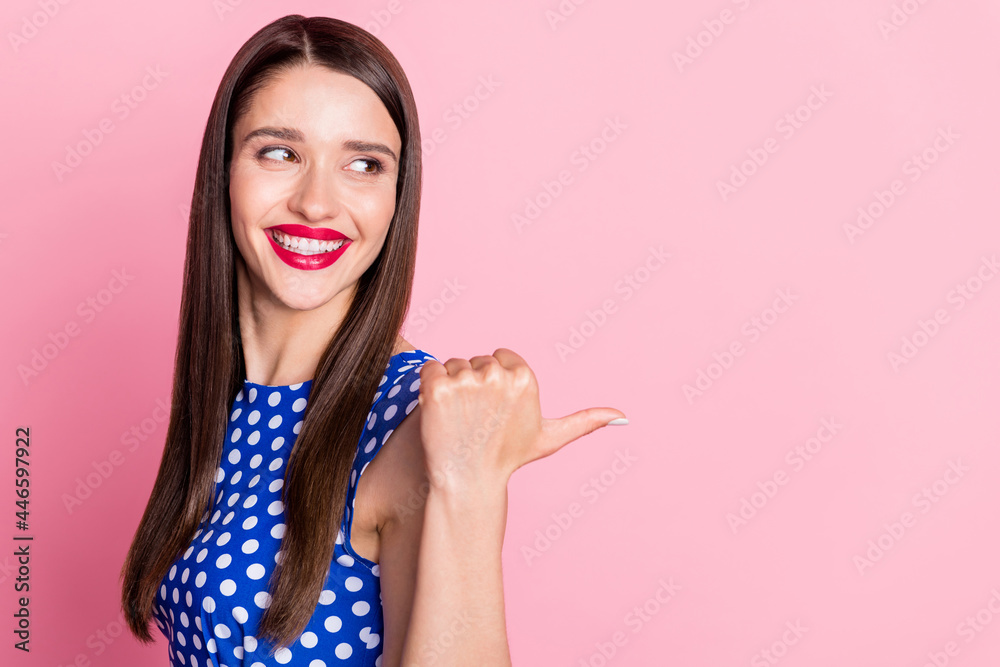 Profile side view portrait of attractive cheerful brown-haired girl showing copy empty space ad isolated over pink pastel color background Profile side view portrait of attractive cheerful brown-haired girl showing copy empty space ad isolated over pink pastel color background