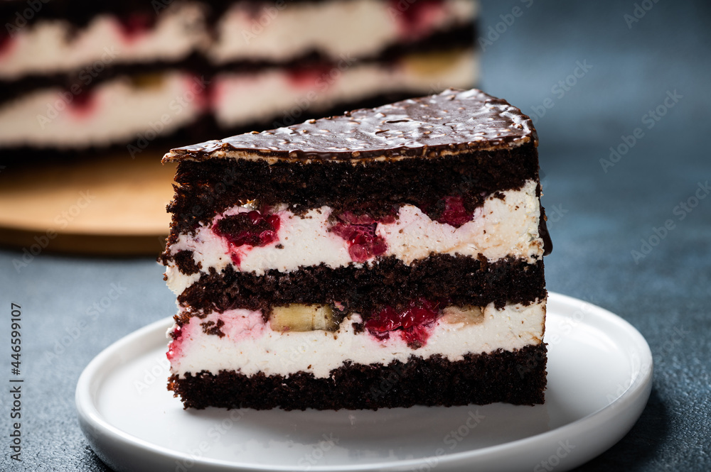 Chocolate cake with raspberry on plate. Slice of cake. Raspberry cake. Wedding dessert. Black forest cake. Delicious dessert. Traditional german dessert Chocolate cake with raspberry on plate. Slice of cake. Raspberry cake. Wedding dessert. Black forest cake. Delicious dessert. Traditional german dessert