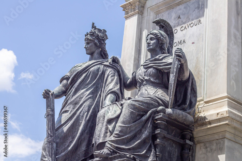 King and queen bronze in the center at Monument to Cavour, there symbolizes  is "Italy", standing and next to it "Rome", seated. Symbolizes,Piazza Cavour (Rome),Italy.