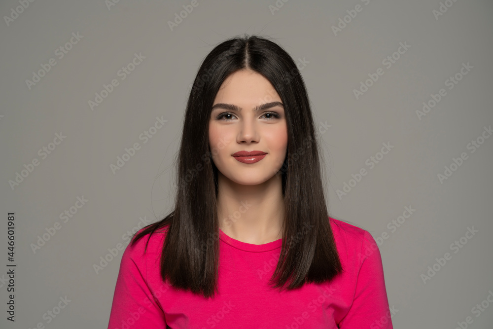 Fototapeta premium portrait of a smiling teen girl with long straight hai