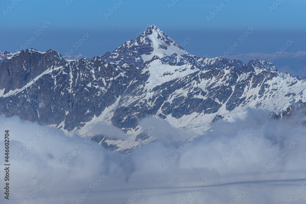 Obraz premium The snow-capped mountains of Valtournenche during a sunny day of initiation near the town of Cervinia, Italy - June 2021