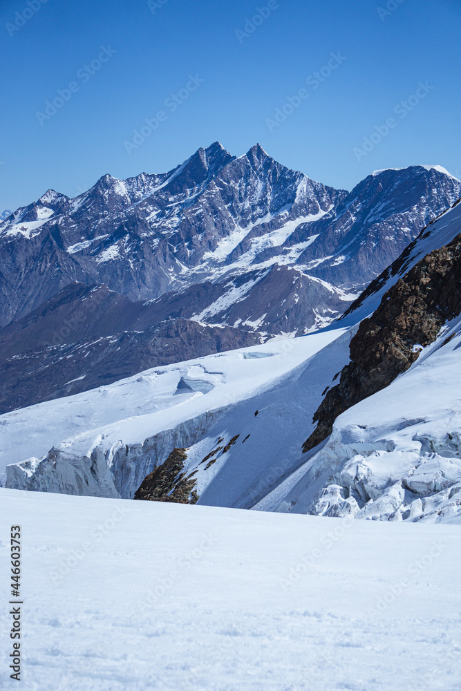 The peaks and glaciers of the Mischabel massif: one of the highest and most spectacular mountain groups of all the Alps seen from the peaks on the border between Italy and Switzerland - June 2021.