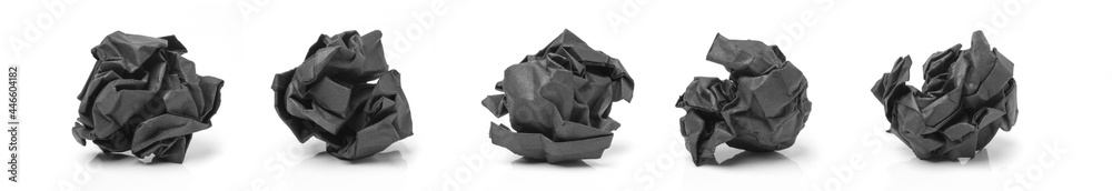 black paper was crumpled into ball isolated on white background