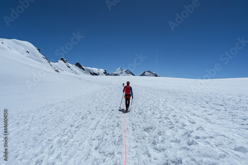 An alpinist climbing to one of the many peaks of the Monte Rosa massif  near the town of Cervinia  Italy - June 2021