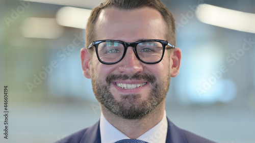 Close up of Middle Aged Businessman Smiling at Camera © stockbakers