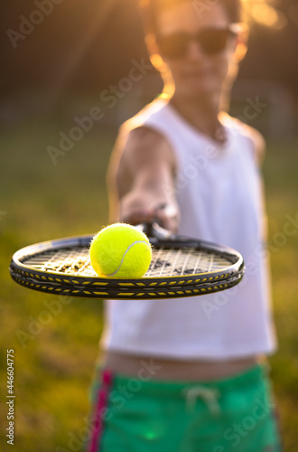 Young beautiful woman with short hair play tennis outdoors © Zkolra