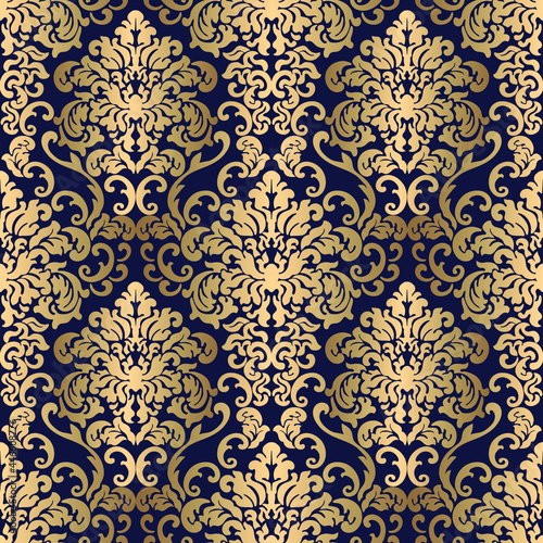 Golden seamless damask pattern on blue background in vector 