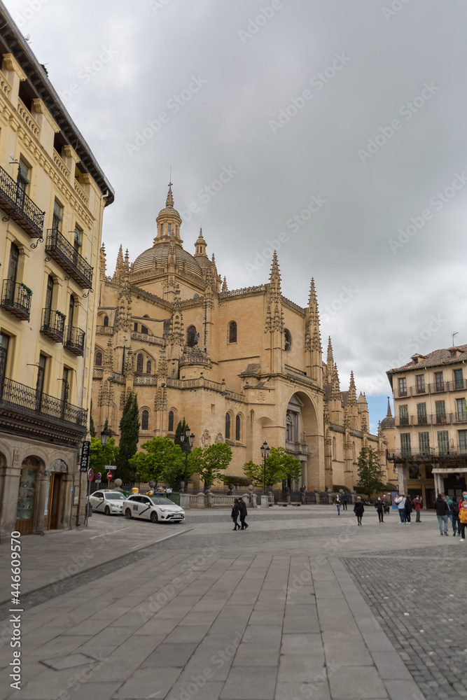 View at the Plaza Mayor and front view at the iconic spanish gothic building at the Segovia cathedral, towers and domes, downtown city