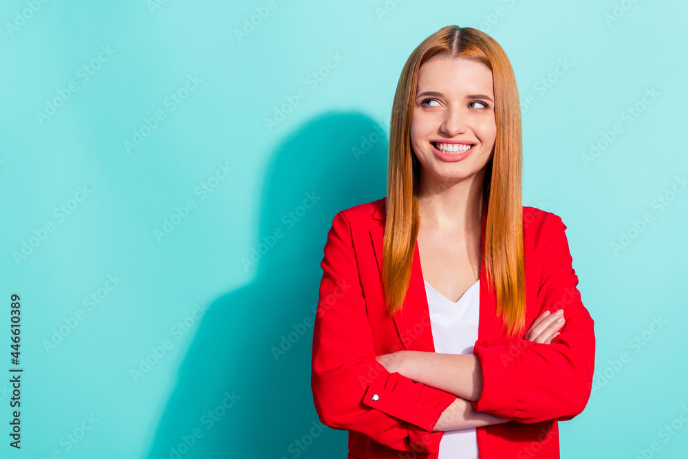 Photo of dreamy pretty orange hair woman dressed red jacket arms crossed looking empty space isolated cyan color background Photo of dreamy pretty orange hair woman dressed red jacket arms crossed looking empty space isolated cyan color background