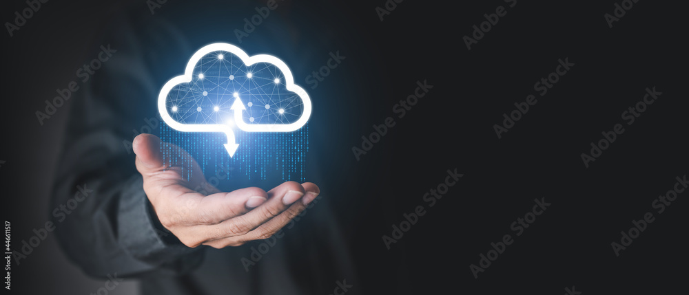Businessman holding a cloud data icon with light and the binary number 1010. The concept of digital traffic is connected to the cloud. Insurance Business computer security concepts. - obrazy, fototapety, plakaty 