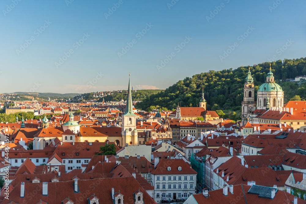 View to Prague red roofs from castle at summer morning