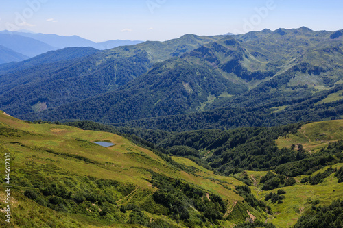 Fototapeta Naklejka Na Ścianę i Meble -  view of mountain lake and alpine meadows in covered with forest caucasus mountains