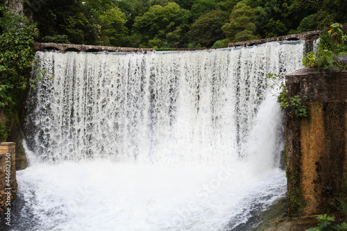 water falling from old power plant dam in New Athons in Georgia