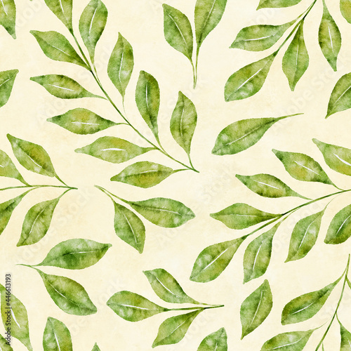 Watercolor floral seamless pattern with green leaves and branches on light yellow background.