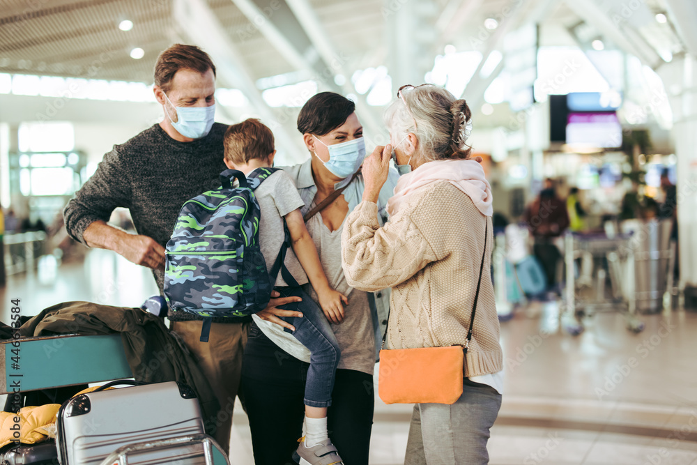 Family reunion at airport after pandemic lockdown