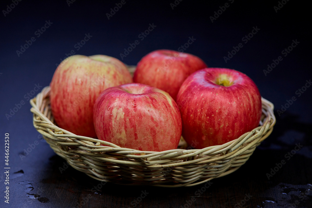 ripe red apple isolated in wicker basket ripe red apple isolated in wicker basket
