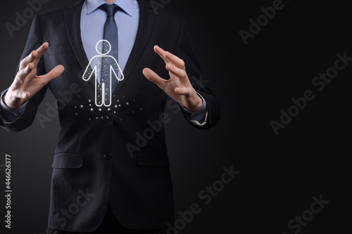 Businessman holds man person icon on dark tone background.HR Human ,people iconTechnology Process System Business with Recruitment, Hiring, Team Building. Organisation structure concept