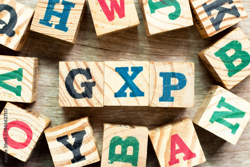 Alphabet letter block in word GXP with another on wood background Stock  Photo | Adobe Stock