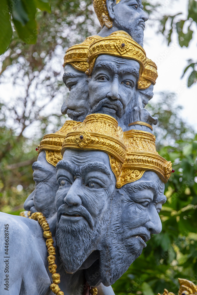 Many heads statue on the street near buddhist temple, Thailand
