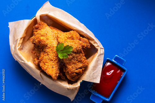 Food concept homemade herbs Crispy Fried Chicken Tenders in wooden tray with copy space