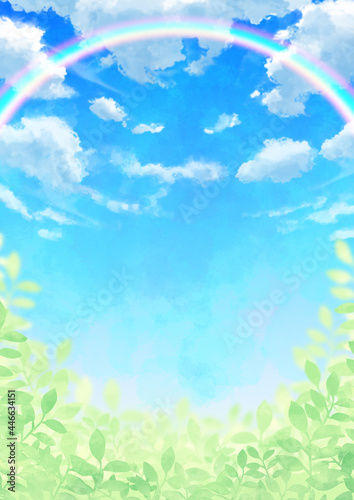 虹のかかった青空と雲と葉っぱ